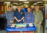 From left, Republic of Korea (ROK) Navy Rear Adm. Su Youl Lee, commander, ROK Navy Submarine Force; U.S. Navy Cmdr. Travis Wood, commanding officer of the Ohio-class ballistic-missile submarine USS Maine (SSBN 741) Gold crew; Japan Maritime Self-Defense Force (JMSDF) Vice Adm. Tateki Tawara, commander, Fleet Submarine Force;, and U.S. Navy Rear Adm. Rick Seif, commander, Submarine Group 7; pose for a photo during an underway embark aboard Maine, April 18.