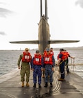 From left, U.S. Navy Rear Adm. Rick Seif, commander, Submarine Group 7; Japan Maritime Self-Defense Force Vice Adm. Tateki Tawara, commander, Fleet Submarine Force; and Republic of Korea (ROK) Navy Rear Adm. Su Youl Lee, commander, ROK Navy Submarine Force; pose for a photo aboard the Ohio-class ballistic missile submarine USS Maine (SSBN 741), April 18. During their time at sea aboard the submarine, the senior leaders were provided tours and demonstrations of the unit’s capabilities, which operates globally under U.S. Strategic Command.