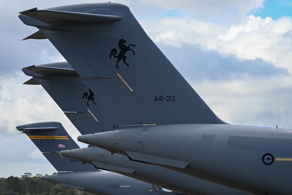 A U.S. Air Force C-17 Globemaster III is parked on the flightline alongside Royal Australian Air Force C-17’s during the start of Exercise Global Dexterity 23-1 at RAAF Base Amberley, Queensland, April 25, 2023. This is the sixth iteration of Exercise Global Dexterity between the United States Air Force and our Indo-Pacific partners, the Royal Australian Air Force, and focuses on strengthening our military partnership in the region. (U.S. Air Force photo by Senior Airman Makensie Cooper)