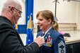 Air National Guard Chief Master Sgt. Michelle Moyer, 270th EIS Senior Enlisted Leader and Project Manager, receives her retirement pin from by her husband, Michael Guldin, during her retirement ceremony at Biddle ANG Base Horsham, Pennsylvania, march 4, 2023. Moyer, 270th EIS Senior Enlisted Leader and Project Manager, received her good-bye salutes and farewell handshakes from her comrades-in-arms after her retirement ceremony at the base where she has served for more than 36 years of her military career. (U.S. Air national Guard photo by Tech. Sgt. Ross Alexander Whitley)