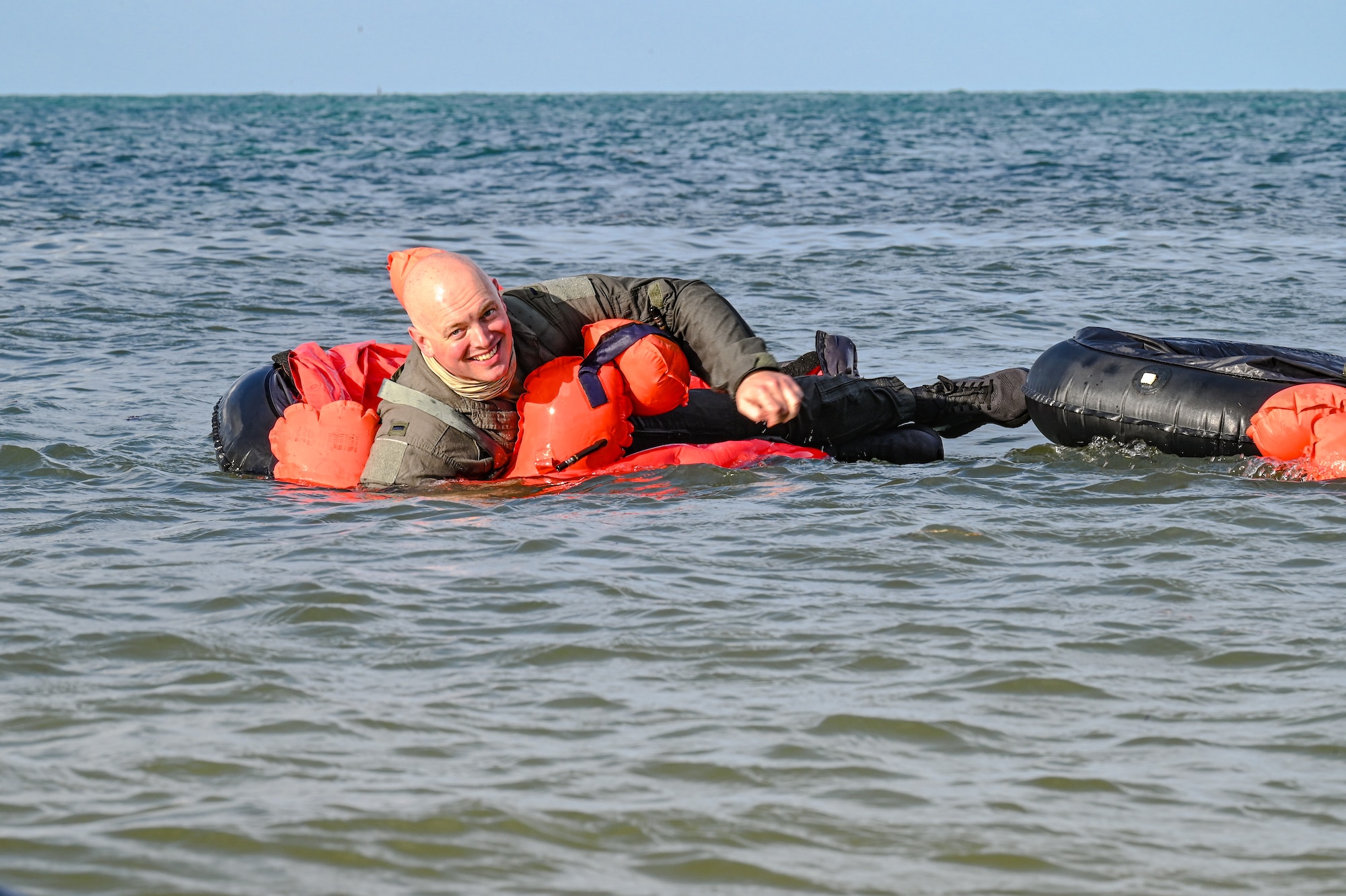 1st Lt. Evan Hart, a pilot assigned to the 757th Airlift Squadron, floats in a one-person life raft during water survival training on April 19, 2023, at Naval Air Station Key West, Florida.