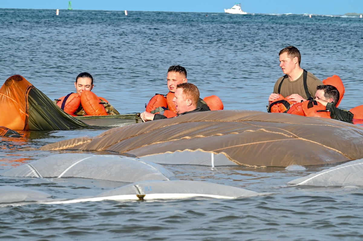Reserve Citizen Airmen assigned to the 910th Airlift Wing tread water during water survival training on April 19, 2023, at Naval Air Station Key West, Florida.
