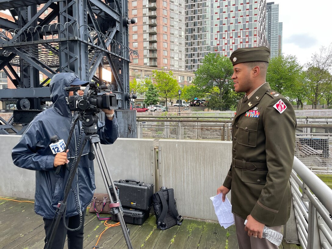 Lieutenant Colonel Matthew Pride speaks with members of the press.