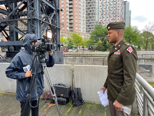 Lieutenant Colonel Matthew Pride speaks with members of the press.