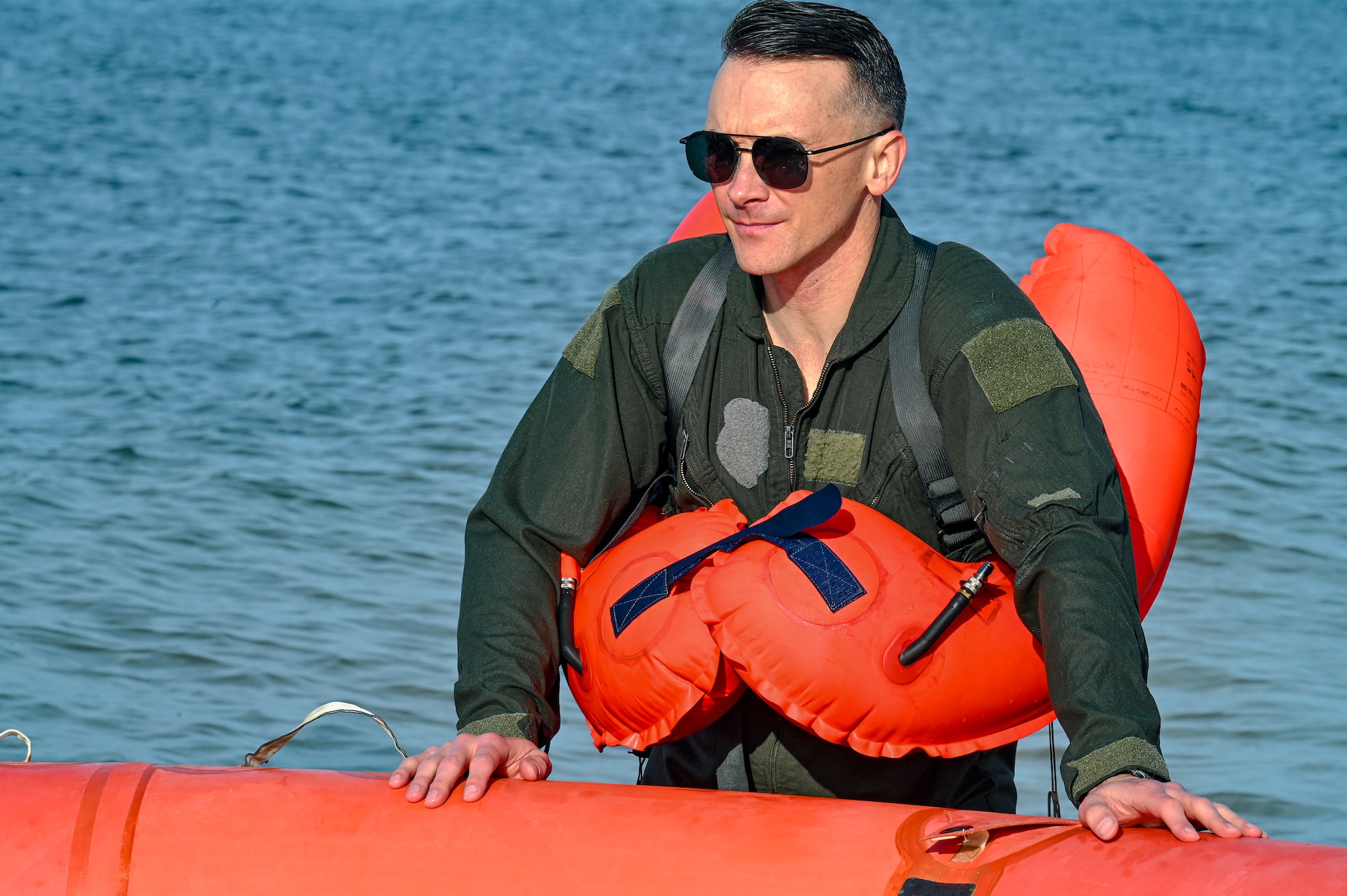 Capt. Gregory Wlazlowski, a pilot assigned to the 757th Airlift Squadron, listens to instructions during water survival training on April 19, 2023, at Naval Air Station Key West, Florida.