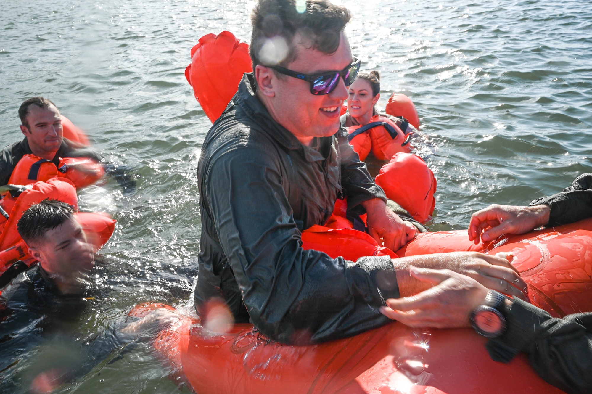 Tech. Sgt. Solomon Walker, a flight engineer assigned to the 757th Airlift Squadron, climbs into a 20-person life raft during water survival training on April 19, 2023, at Naval Air Station Key West, Florida.