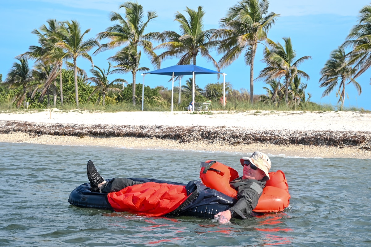 Lt. Col. Ryan Cooley, the chief of aerial spray assigned to the 757th Airlift Squadron, floats in a one-person life raft on April 19, 2023, at Naval Air Station Key West, Florida.