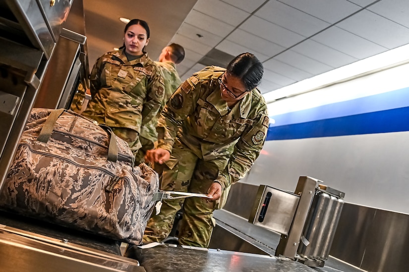 U.S. Air Force Airman 1st Class Marian Tawfik, 305th Aerial Port Squadron air transportation specialist, in-processes travelers at the 305th APS Passenger Terminal on 19 April, 2023, at Joint Base McGuire-Dix-Lakehurst, N.J. Tawfik, an immigrant from Minya, Egypt, won a work Visa through the U.S. Embassy lottery and eventually attained her citizenship in the United States.