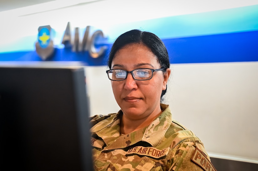 U.S. Air Force Airman 1st Class Marian Tawfik, 305th Aerial Port Squadron air transportation specialist, in-processes travelers at the 305th APS Passenger Terminal on 19 April, 2023, at Joint Base McGuire-Dix-Lakehurst, N.J. Tawfik, an immigrant from Minya, Egypt, won a work Visa through the U.S. Embassy lottery and eventually attained her citizenship in the United States.