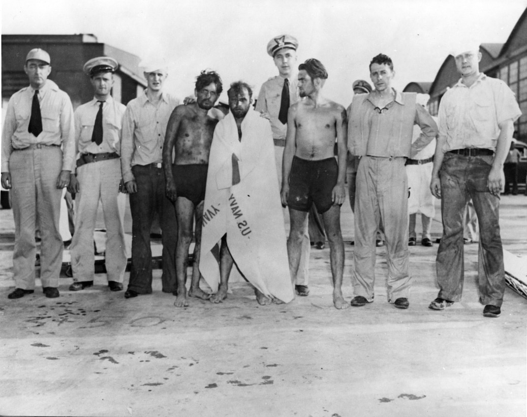 Famous CG pilot Richard Burke poses with German survivors of the sunken u-boat U-701.  Burke saved them off the coast of North Carolina after an Army Air Corps plane sank their u-boat.