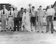 Famous CG pilot Richard Burke poses with German survivors of the sunken u-boat U-701.  Burke saved them off the coast of North Carolina after an Army Air Corps plane sank their u-boat.