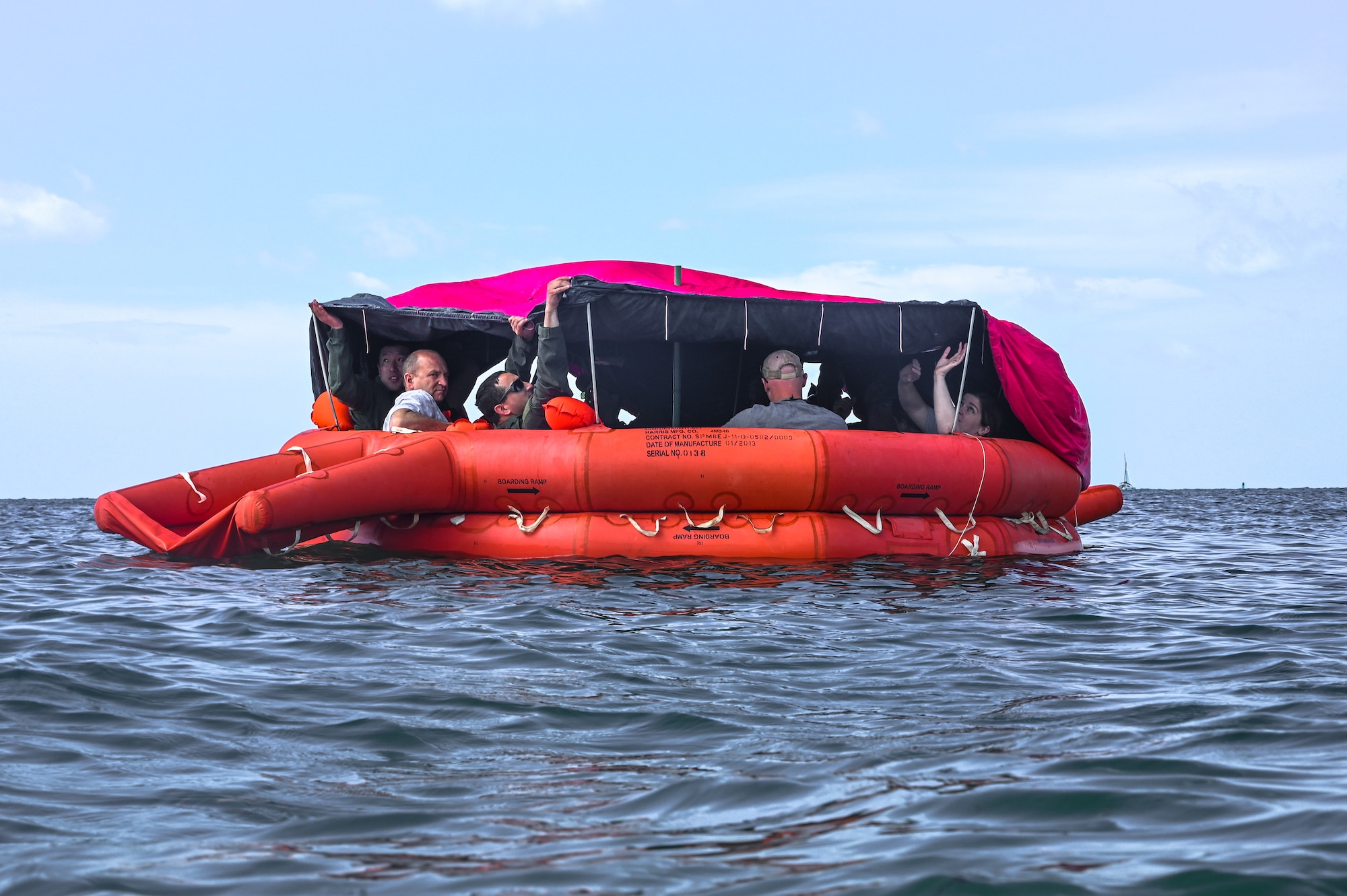 Reserve Citizen Airmen assigned to the 910th Airlift Wing float in a 20-person life raft during water survival training on April 19, 2023, at Naval Air Station Key West, Florida.