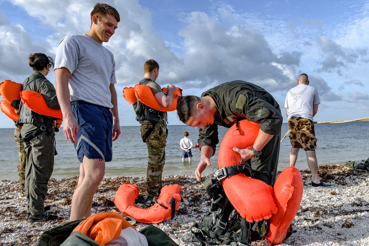 Reserve Citizen Airmen assigned to the 910th Airlift Wing check water survival equipment during training on April 19, 2023, at Naval Air Station Key West, Florida.
