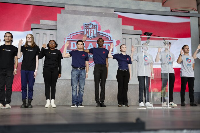 Future service members attend the 2023 National Football League Draft at Union Station, Kansas City, Missouri, April 30, 2023. Future service members reaffirmed their oath of enlistment to their prospective branches on stage during day 3 of the NFL Draft. (U.S. Marine Corps photo by Cpl. Alexis Moradian)