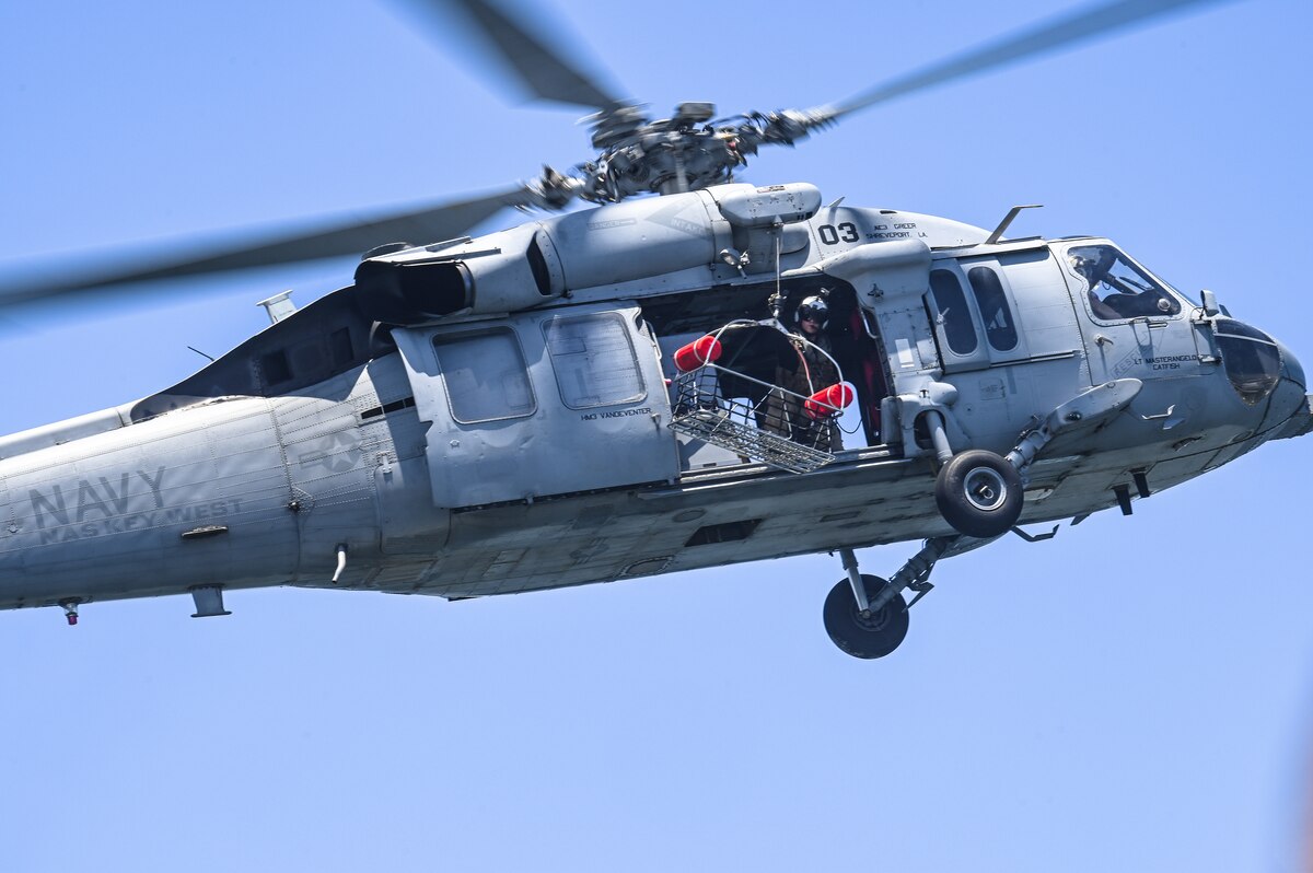 An MH-60S Multi-Mission Helicopter assigned to Naval Air Station Key West conducts a mass casualty rescue exercise alongside Reserve Citizen Airmen assigned to the 910th Airlift Wing on April 19, 2023, at NAS Key West, Florida.