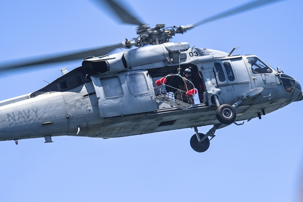 An MH-60S Multi-Mission Helicopter assigned to Naval Air Station Key West conducts a mass casualty rescue exercise alongside Reserve Citizen Airmen assigned to the 910th Airlift Wing on April 19, 2023, at NAS Key West, Florida.