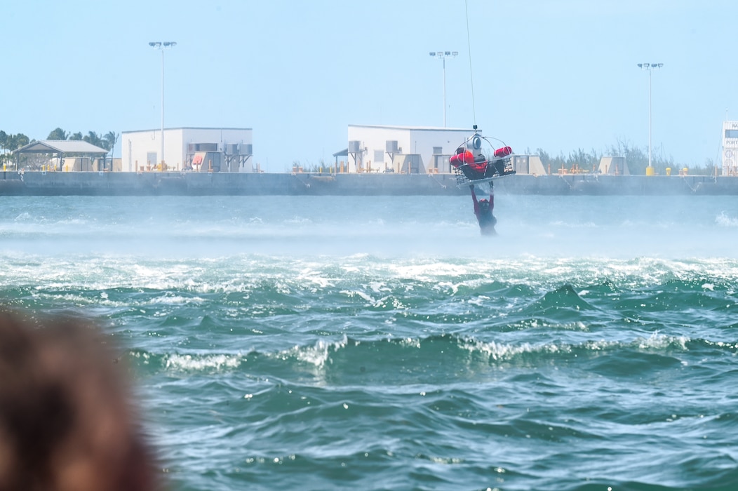 Tech. Sgt. Solomon Walker, a flight engineer assigned to the 757th Airlift Squadron, is lifted out of the water during a mass casualty rescue exercise on April 19, 2023, at Naval Air Station Key West, Florida.