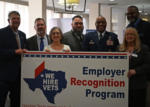 U.S. Air Force Col. Eugene Moore, 17th Mission Support Group commander, poses with the Texas Workforce Commission during the Texas Conference for Employers, Midland, Texas, May 5, 2023. Veterans comprised 65% of Goodfellow Air Force Base’s workforce and played a vital role in the mission to train the future force. (U.S. Air Force photo by Senior Airman Sarah Williams)