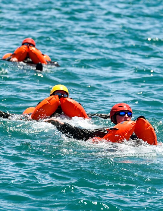 Reserve Citizen Airmen assigned to the 910th Operations Group tread water during a mass casualty rescue exercise on April 19, 2023, at Naval Air Station Key West, Florida.