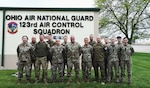 Airmen assigned to the 123rd Air Control Squadron pose for a portrait alongside service members from Lithuania, Latvia and Hungary during a joint training exercise April 28, 2023 in Blue Ash, Ohio.