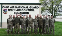 Airmen assigned to the 123rd Air Control Squadron pose for a portrait alongside service members from Lithuania, Latvia and Hungary during a joint training exercise April 28, 2023 in Blue Ash, Ohio.