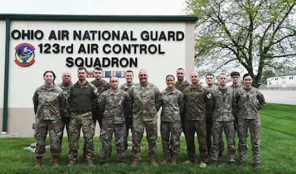 Airmen assigned to the 123rd Air Control Squadron pose for a portrait alongside service members from Lithuania, Latvia and Hungary during a joint training exercise April 28, 2023 in Blue Ash, Ohio.