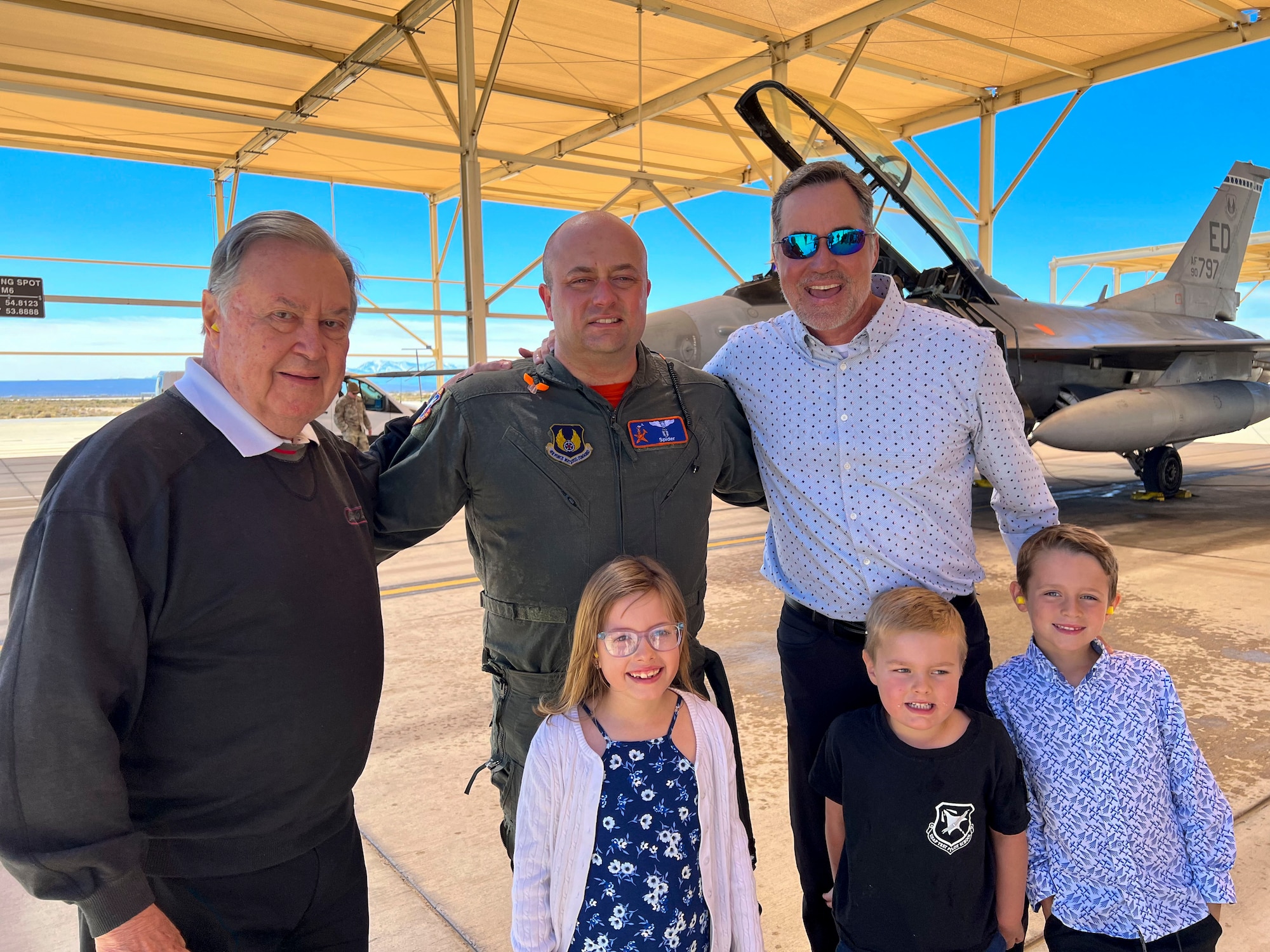 Lt. Col. Matthew Taranto, Chief Aerospace Physiologist, U.S. Air Force Test Pilot School takes a picture with his family and friends after conducting his "fini-flight" before retirement March 31st. (Photo courtesy of Staff Sgt. Elizabeth Taranto)
