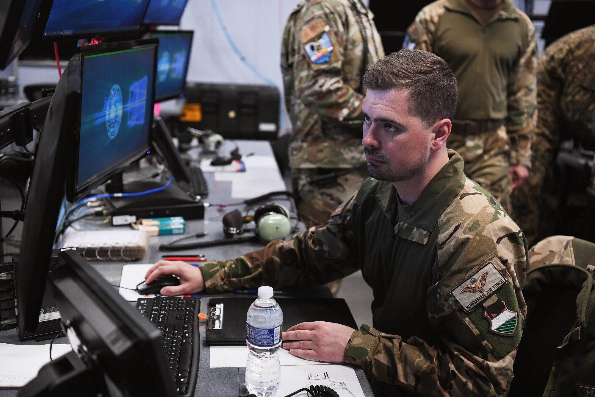 Airmen assigned to the 123rd Air Control Squadron train alongside service members from Lithuania, Latvia and Hungary during a joint training exercise April 28, 2023 in Blue Ash, Ohio. Success in contested environments depends on how well U.S. forces combine with the broad range of allied and partner capabilities and expertise to secure our common interests and promote our shared values. (U.S. Air National Guard photo by Shane Hughes)