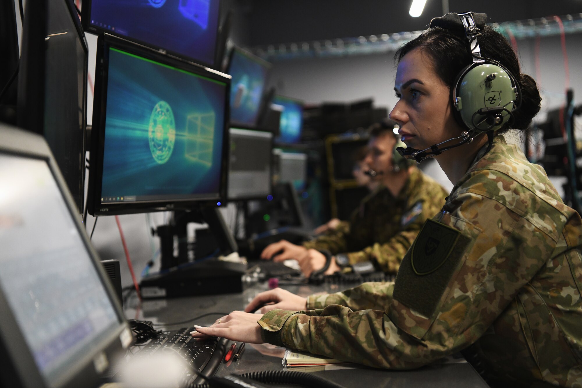 Lithuanian Air Force Staff Sgt. Kristina Dabuzinskiene trains on air battle management tactics April 28, 2023 during a joint training exercise with airmen assigned to the Ohio Air National Guard's 123rd Air Control Squadron in Blue Ash, Ohio. International allies and partners are a force multiplier and one of the greatest strategic assets the U.S. has as a nation. (U.S. Air National Guard photo by Shane Hughes)