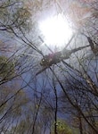 A Tennessee Army National Guard Black Hhawk helicopter locates a distressed hunter in the Cherokee National Forest on May 4.