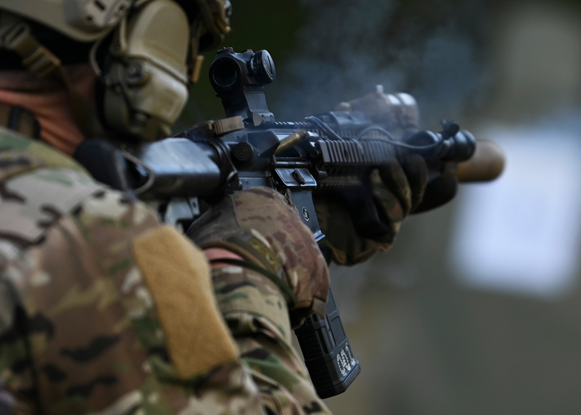 A U.S. Air Force Special Tactics Airman with the 22nd Special Tactics Squadron fires an M4 weapon system at Joint Base Lewis-McChord, Washington, April 19, 2023. Multiple times a year, the 5th Air Support Operations Squadron holds a basic proficiency training in small arms tactics focused on safely maneuvering with the M4 and M18 weapons. (U.S. Air Force photo by Senior Airman Callie Norton)