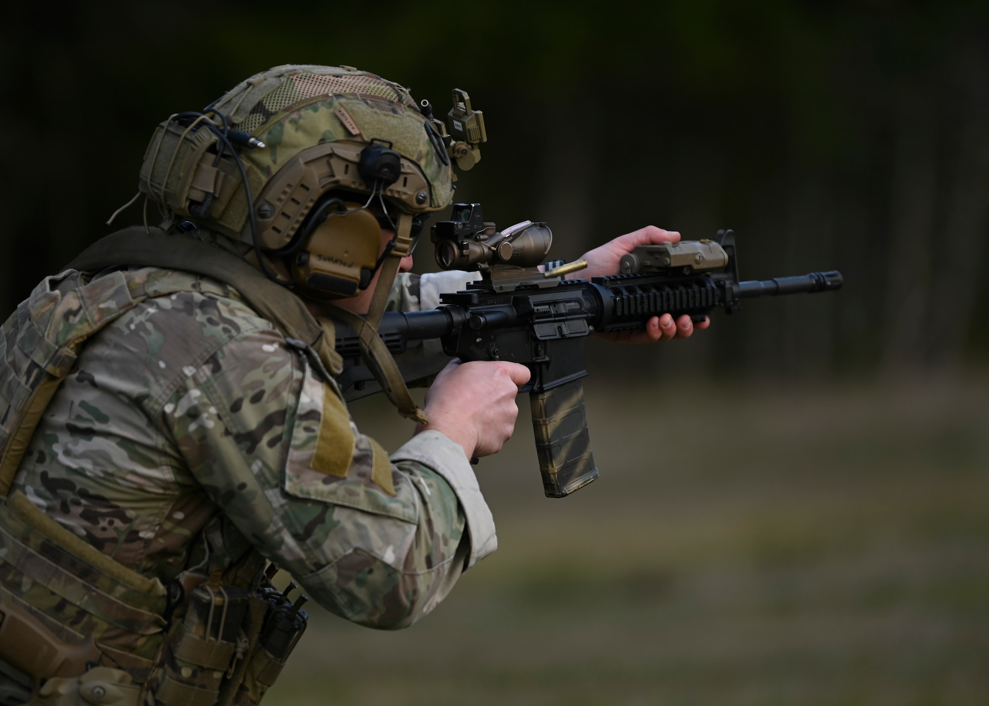 A U.S. Air Force tactical air control party Airman with the 5th Air Support Operations Squadron fires an M4 weapon system at Joint Base Lewis-McChord, Washington, April 19, 2023. Multiple times a year, the 5th ASOS holds a basic proficiency training in small arms tactics focused on safely maneuvering with the M4 and M18 weapons. (U.S. Air Force photo by Senior Airman Callie Norton)