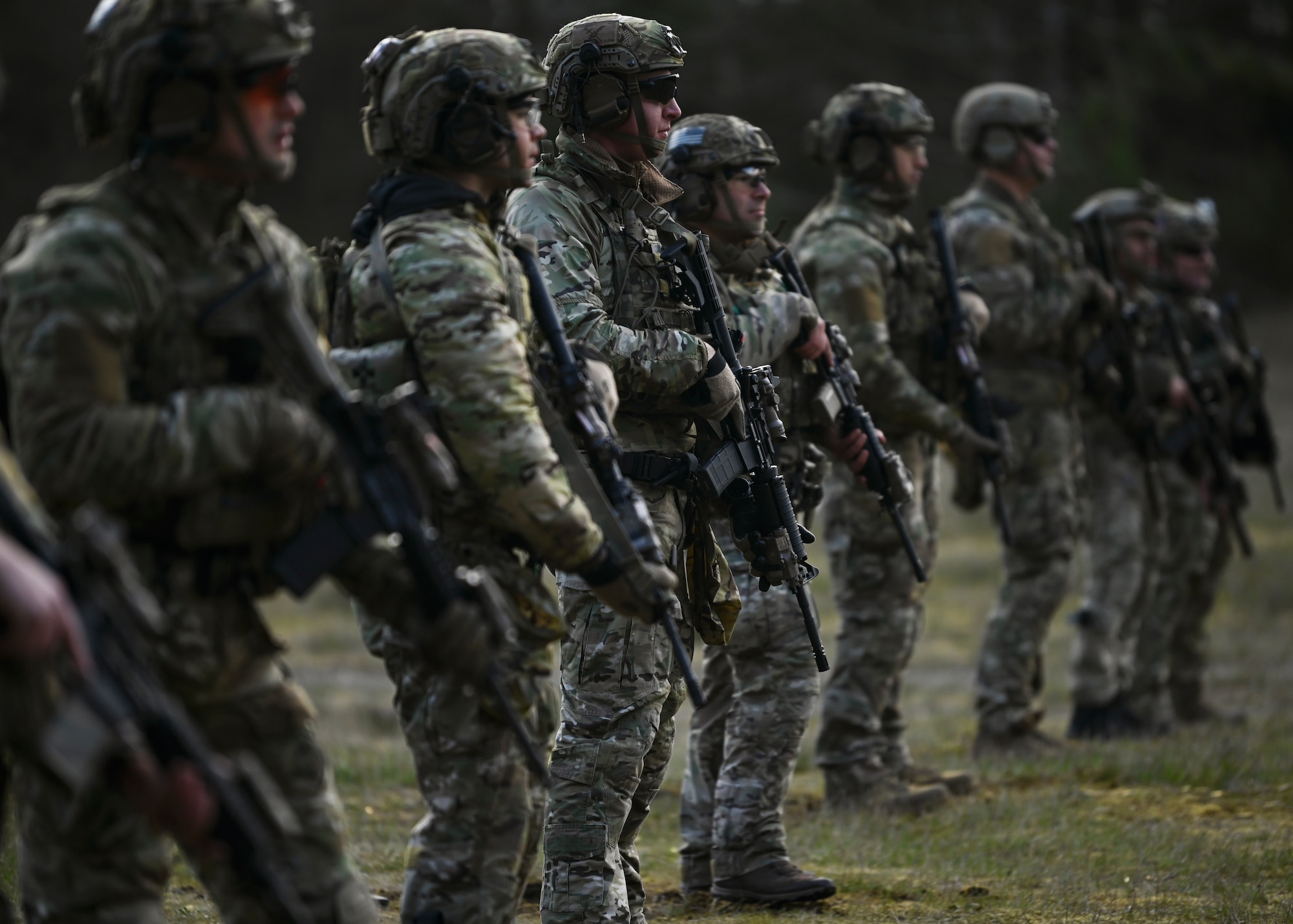 U.S. Air Force tactical air control party Airmen with the 5th Air Support Operations Squadron listen to instructions during a training at Joint Base Lewis-McChord, Washington, April 19, 2023. Multiple times a year, the 5th ASOS holds a basic proficiency training in small arms tactics focused on safely maneuvering with the M4 and M18 weapons. (U.S. Air Force photo by Senior Airman Callie Norton)