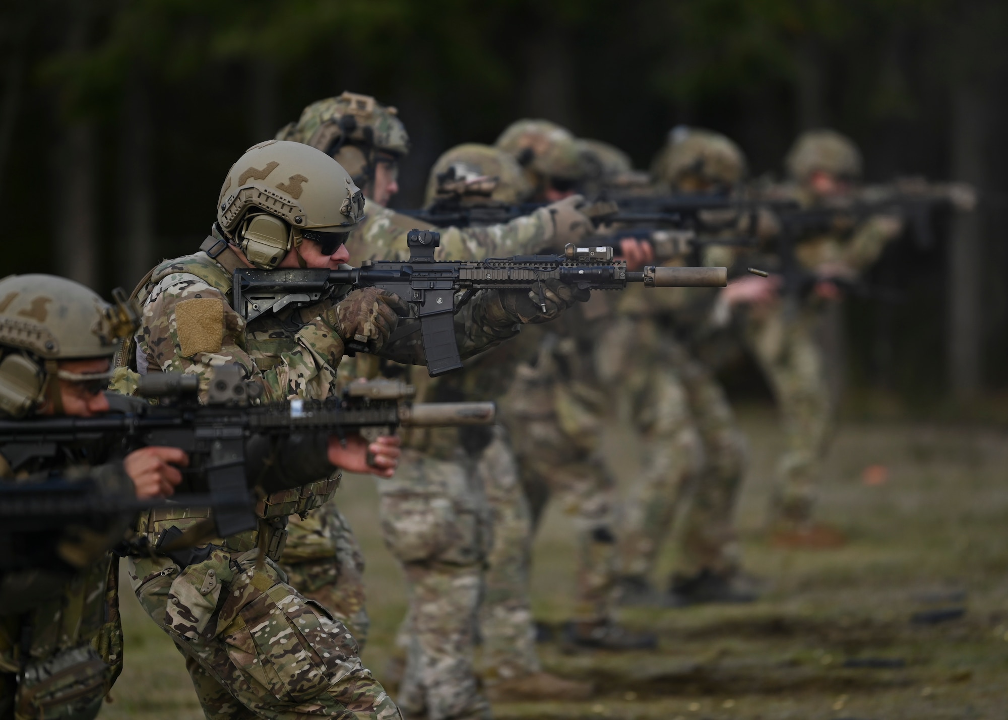 U.S. Air Force tactical air control party Airmen with the 5th Air Support Operations Squadron and Special Tactics Airmen with the 22nd Special Tactics Squadron fire M4 weapon systems at Joint Base Lewis-McChord, Washington, April 19, 2023. Multiple times a year, the 5th ASOS holds a basic proficiency training in small arms tactics focused on safely maneuvering with the M4 and M18 weapons. (U.S. Air Force photo by Senior Airman Callie Norton)