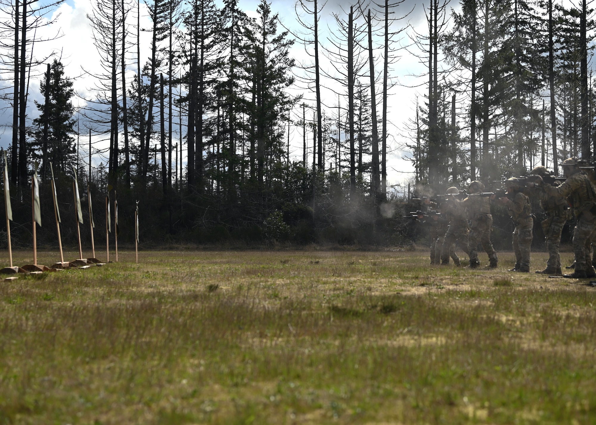 U.S. Air Force tactical air control party Airmen with the 5th Air Support Operations Squadron fire M4 weapon systems at Joint Base Lewis-McChord, Washington, April 19, 2023. Multiple times a year, the 5th ASOS holds a basic proficiency training in small arms tactics focused on safely maneuvering with the M4 and M18 weapons. (U.S. Air Force photo by Senior Airman Callie Norton)