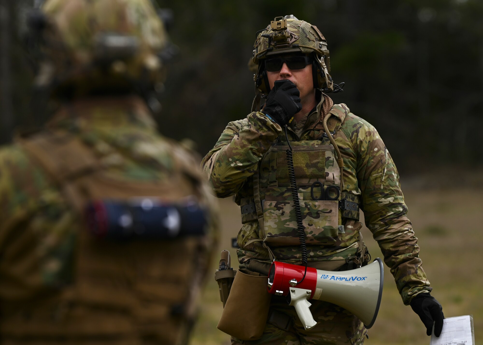 U.S. Air Force Staff Sgt. Cory Lesinger, basic small arms training program manager and electrical power production NCOIC with the 5th Air Support Operations Squadron, instructs tactical air control party Airmen during a training at Joint Base Lewis-McChord, Washington, April 19, 2023. Multiple times a year, the 5th ASOS holds a basic proficiency training in small arms tactics focused on safely maneuvering with the M4 and M18 weapons. (U.S. Air Force photo by Senior Airman Callie Norton)