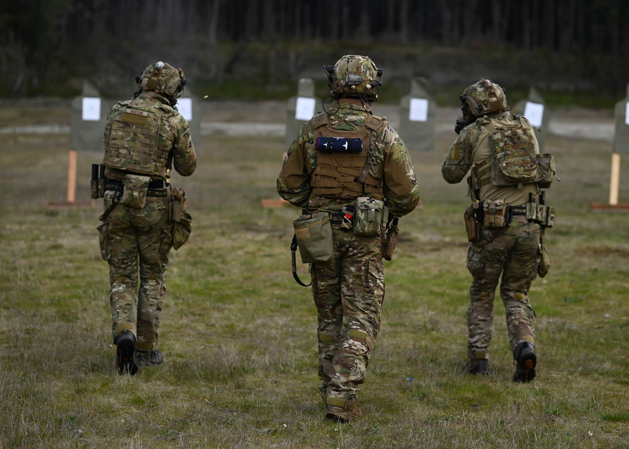 U.S. Air Force tactical air control party Airmen with the 5th Air Support Operations Squadron safely maneuver while firing M4 weapon systems at Joint Base Lewis-McChord, Washington, April 19, 2023. Multiple times a year, the 5th ASOS holds a basic proficiency training in small arms tactics focused on safely maneuvering with the M4 and M18 weapons. (U.S. Air Force photo by Senior Airman Callie Norton)