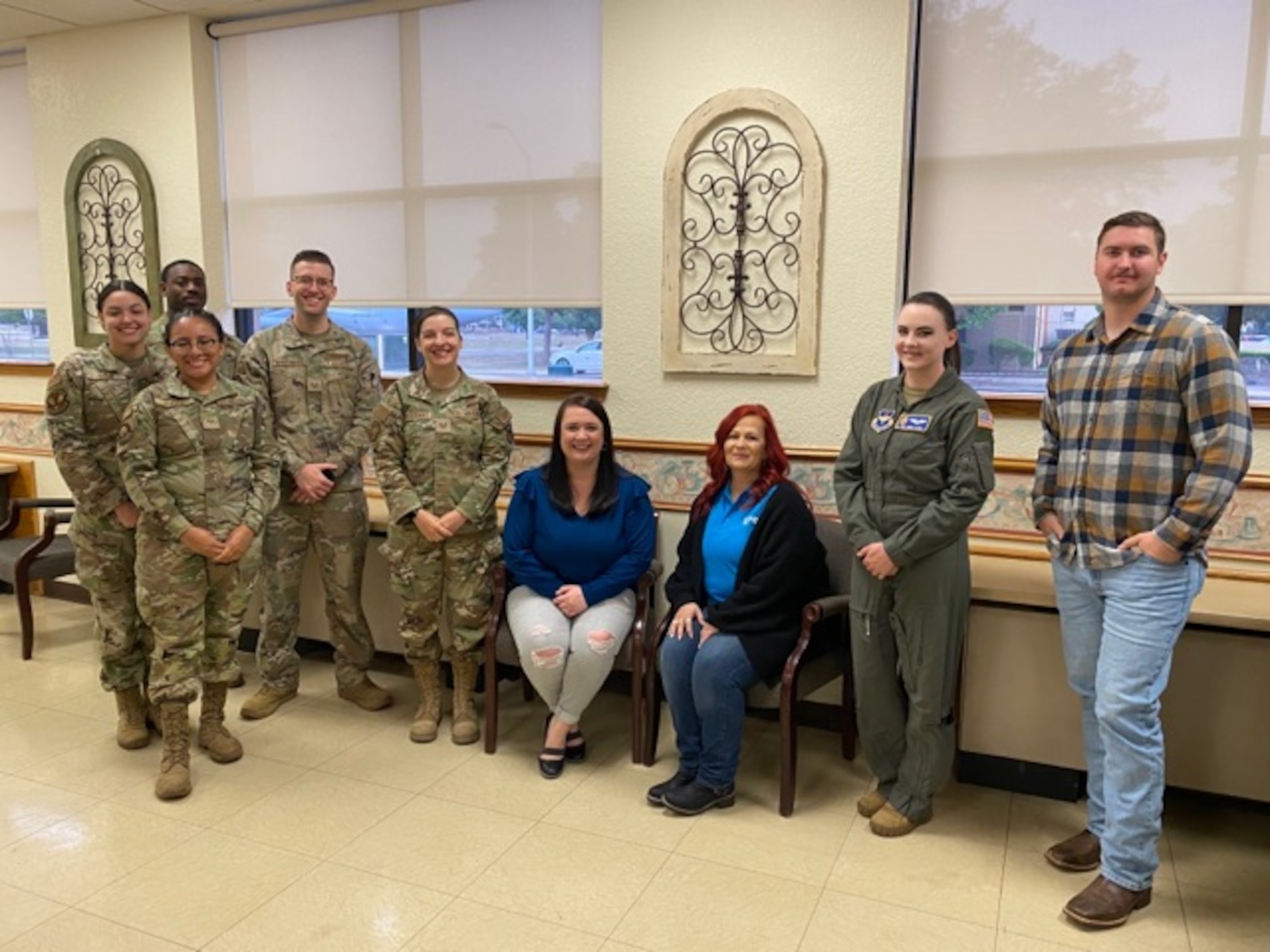 The 97th Air Mobility Wing Sexual Assault Prevention and Response team pose for a photo at Altus Air Force Base, April 26, 2023. The team is made up of volunteer Airmen victim advocates and civilian staff members. (U.S. Air Force photo courtesy of Leah Harris)