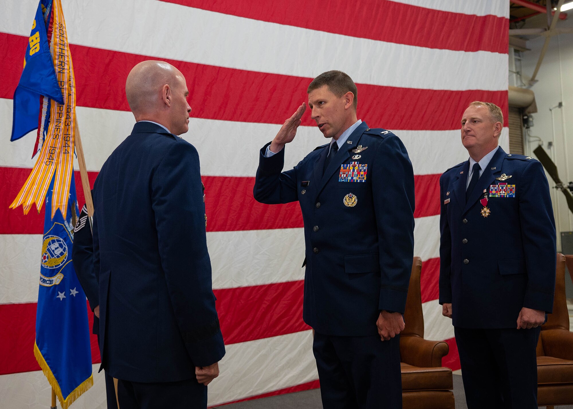 Air Force colonel saluting general in dress uniform