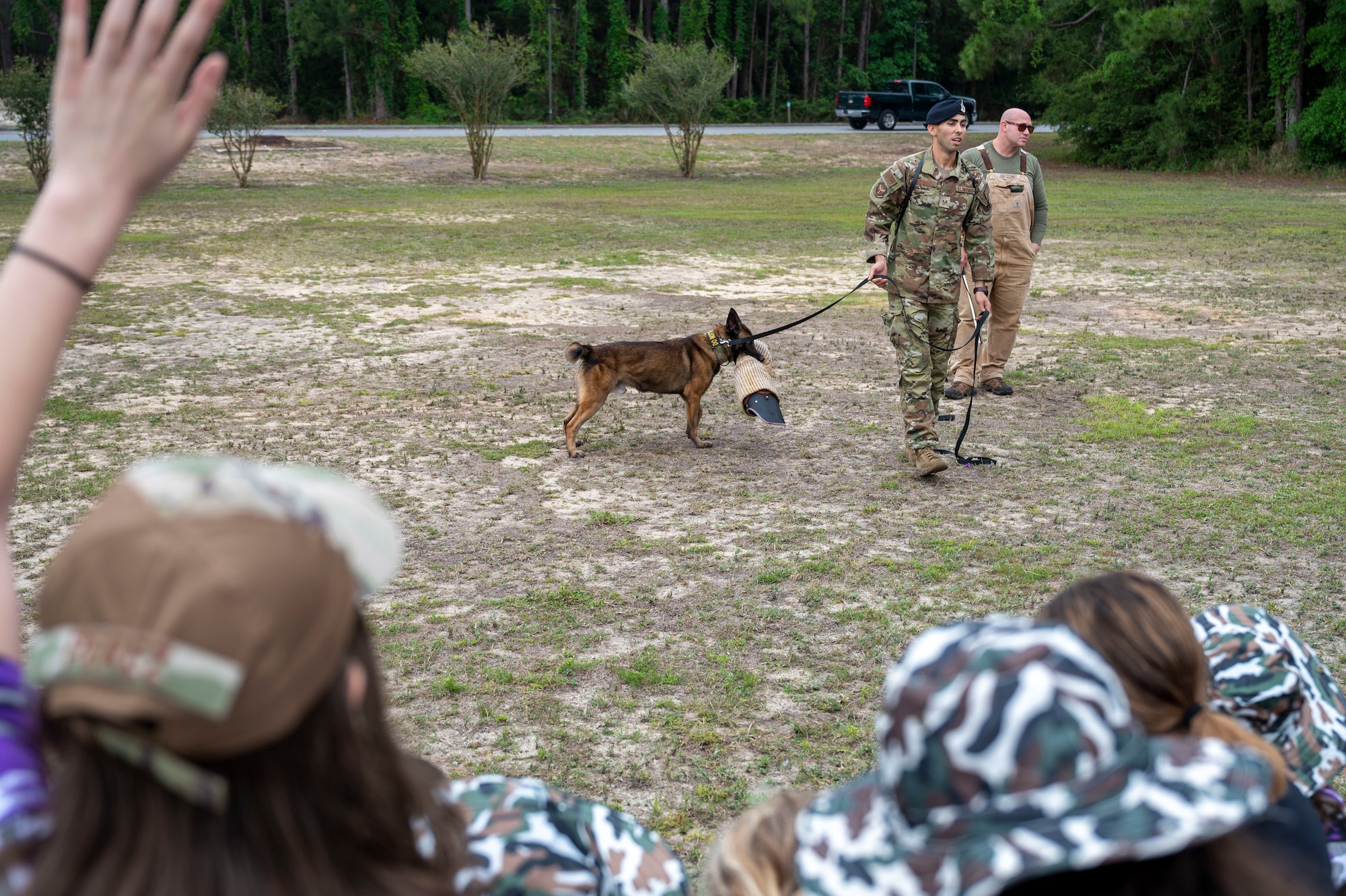 Military children attend a military working dog demonstration during Operation Kids Understanding Deployment Operations at Hurlburt Field, Fla., April 29, 2023.