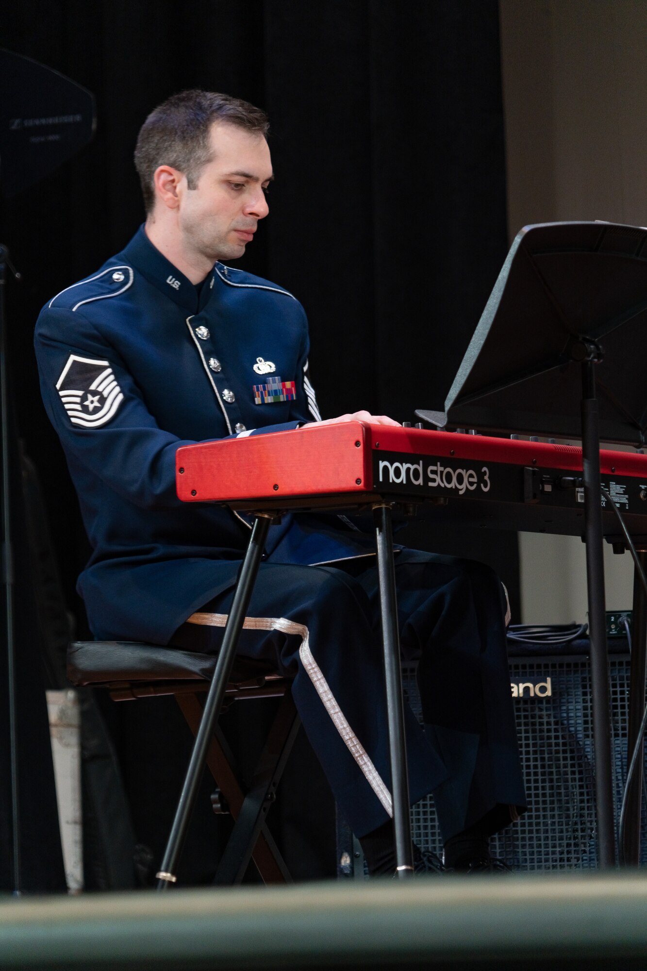 Master Sgt. Chris Ziemba, pianist and non-commissioned officer in command of flight operations for the Airmen of Note (the Note), plays during a concert in his hometown area of Williamsville, New York, May 1, 2023.