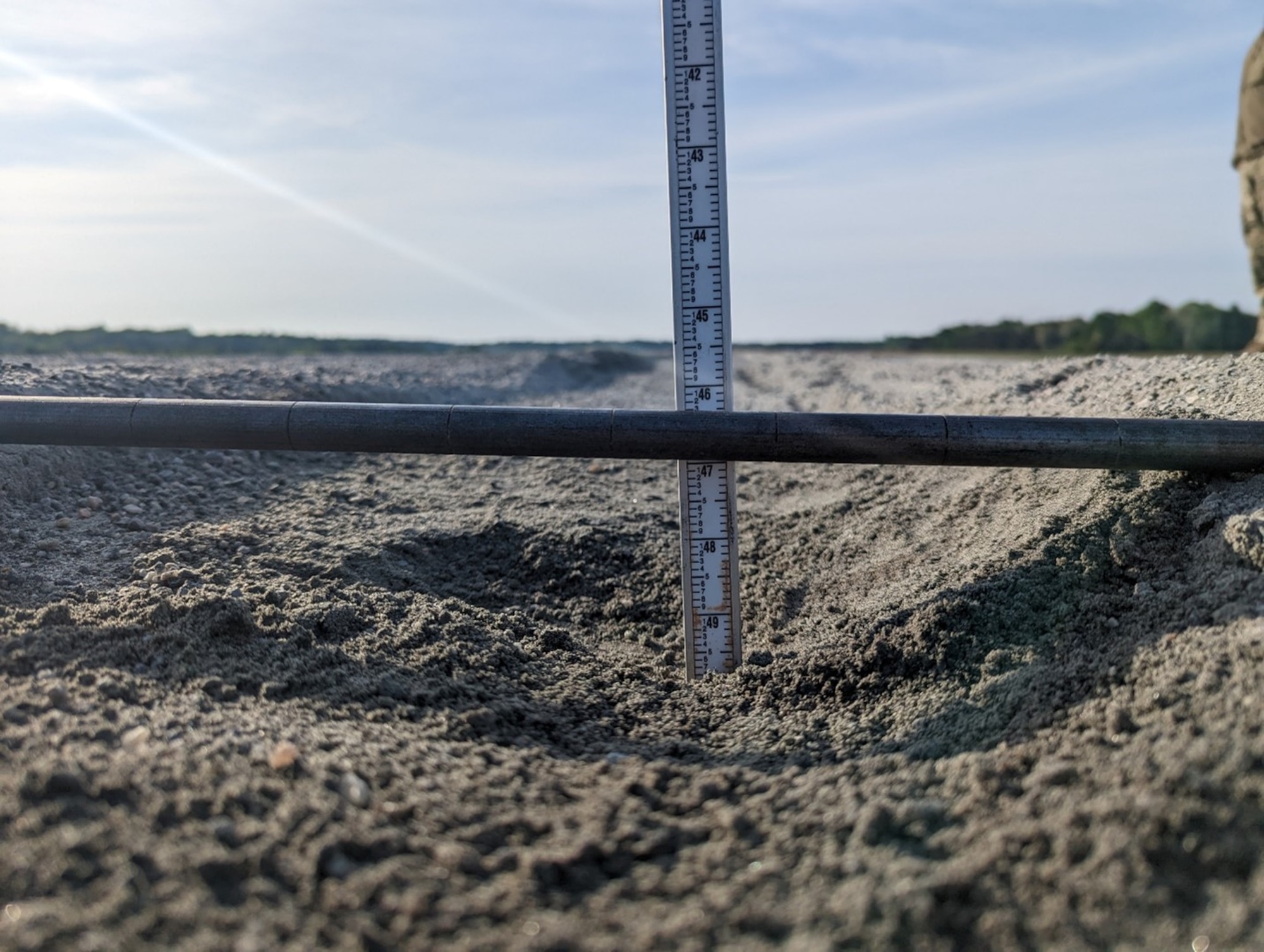 Engineers measure ruts resulting from a C-130 performing assault landings at Fort A.P. Hill, Virginia, April 26, 2023. (U.S. Air Force photo by Capt. Glenn Grecia)