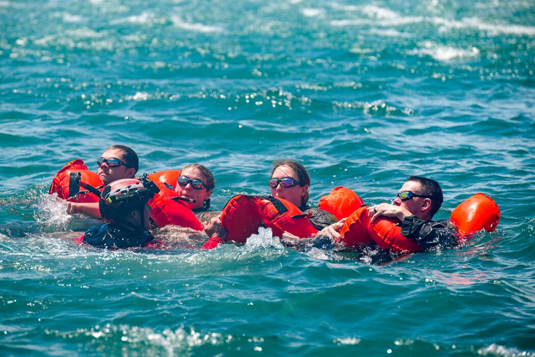 Reserve Citizen Airmen assigned to the 910th Operations Group tread water during a mass casualty rescue exercise on April 19, 2023, at Naval Air Station Key West, Florida.