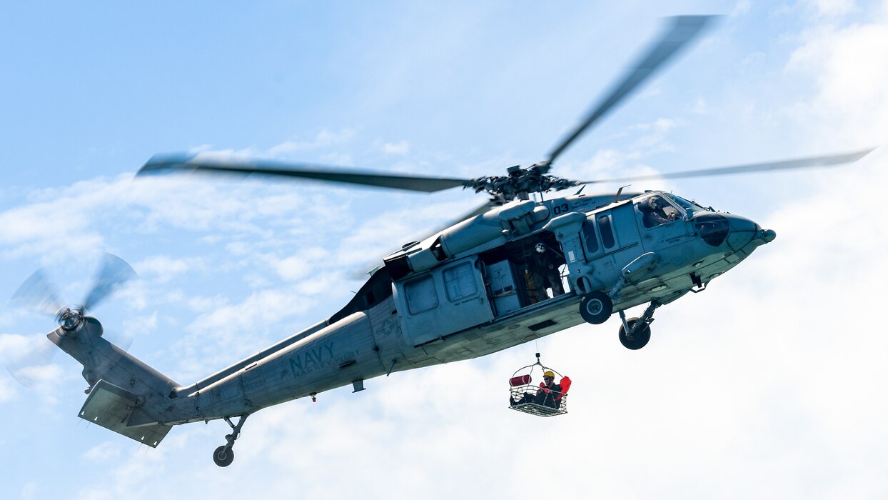 1st Lt. Michael Duniec, a navigator assigned to the 757th Airlift Squadron, is lifted out of the water and into an MH-60S Multi-Mission Helicopter assigned to Naval Air Station Key West during a mass casualty rescue exercise on April 19, 2023, at NAS Key West, Florida.