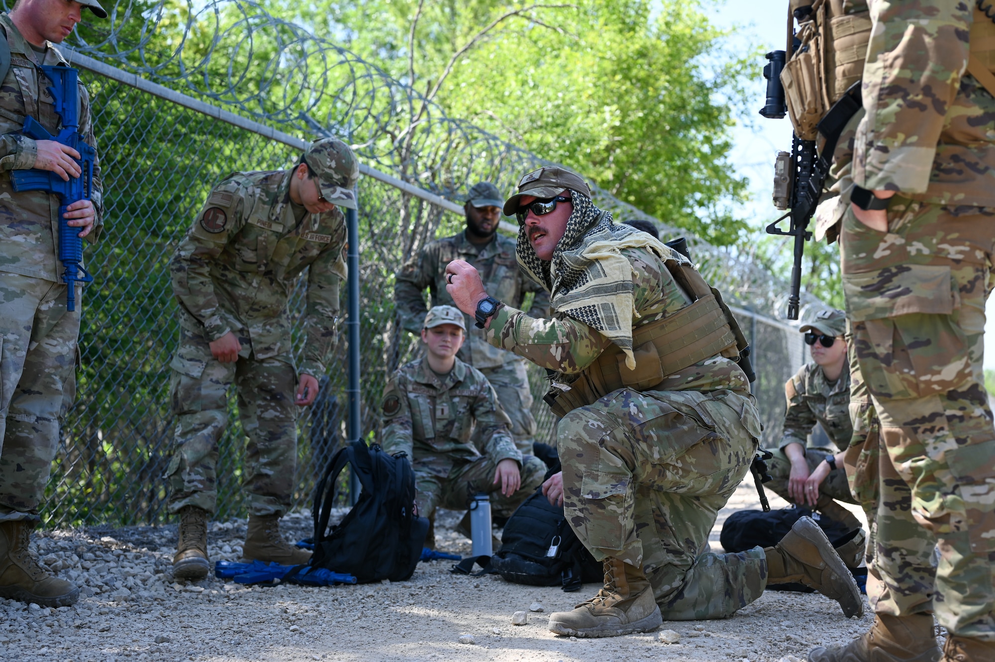 U.S. Air Force Tech Sgt. Anthony Scharf, 47th Security Forces Squadron non-commissioned officer in charge of plans and programs, explains a plan of action during a training exercise at Laughlin Air Force Base, Texas, on April 28, 2023.