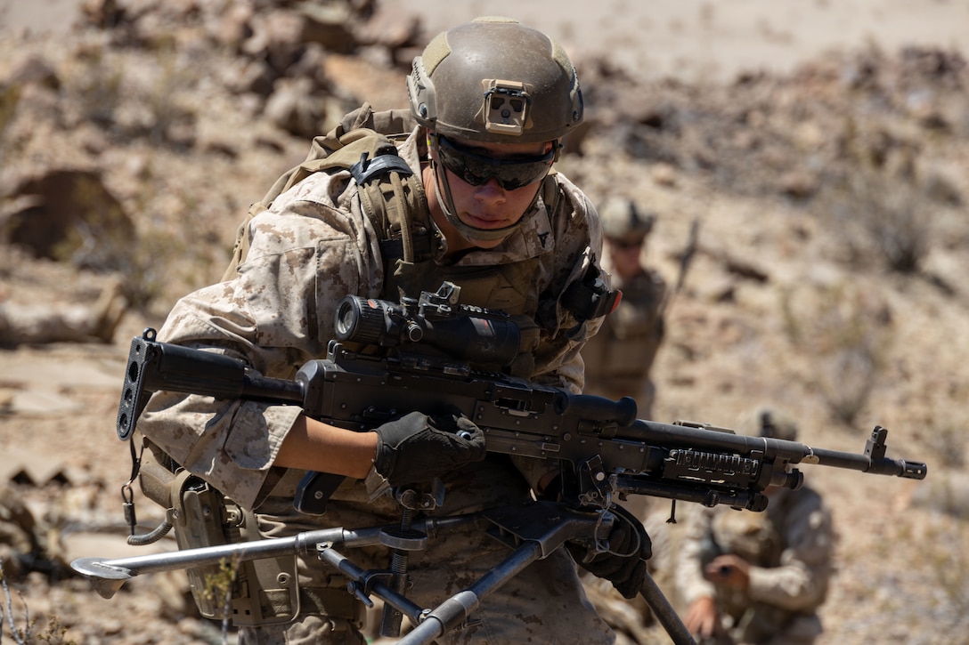 U.S. Marine Corps Lance Cpl. Samuel Sherry, a machine gunner with 2nd Battalion, 2nd Marine Regiment, 2nd Marine Division, displaces to change firing positions during Marine Air-Ground Task Force Distributed Maneuver Exercise (MDMX), at Marine Corps Air Ground Combat Center, Twentynine Palms, California, April 26, 2023. MDMX is a maneuver exercise that incorporates air, ground, and logistics operations to create favorable conditions for the Joint Force. (U.S. Marine Corps photo by Lance Cpl. Anna Higman)