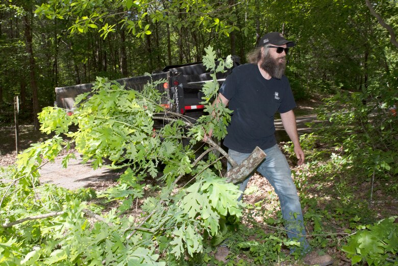 Zach Dixson, park contractor representative with the U.S. Army Corps of Engineers Nashville District at J. Percy Priest Lake, clears branches May 1, 2023, from near a park entrance at Poole Knobs Campground in La Vergne, Tennessee. (USACE Photo by Lee Roberts)