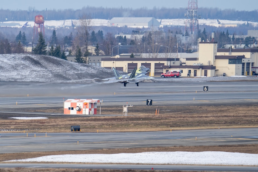 An F-22 Raptor takes off from the flight line on Joint Base Elmendorf-Richardson