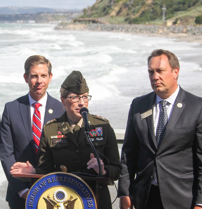 Col. Julie Balten, U.S. Army Corps of Engineers Los Angeles District commander, delivers remarks during a May 4 press conference and signing ceremony in San Clemente, California, marking the collaboration on a project to reduce erosion and protect coastal infrastructure from storm-induced waves along the San Clemente shoreline. Also pictured is U.S. Rep. Mike Levin, left, and San Clemente Mayor Chris Duncan, right.