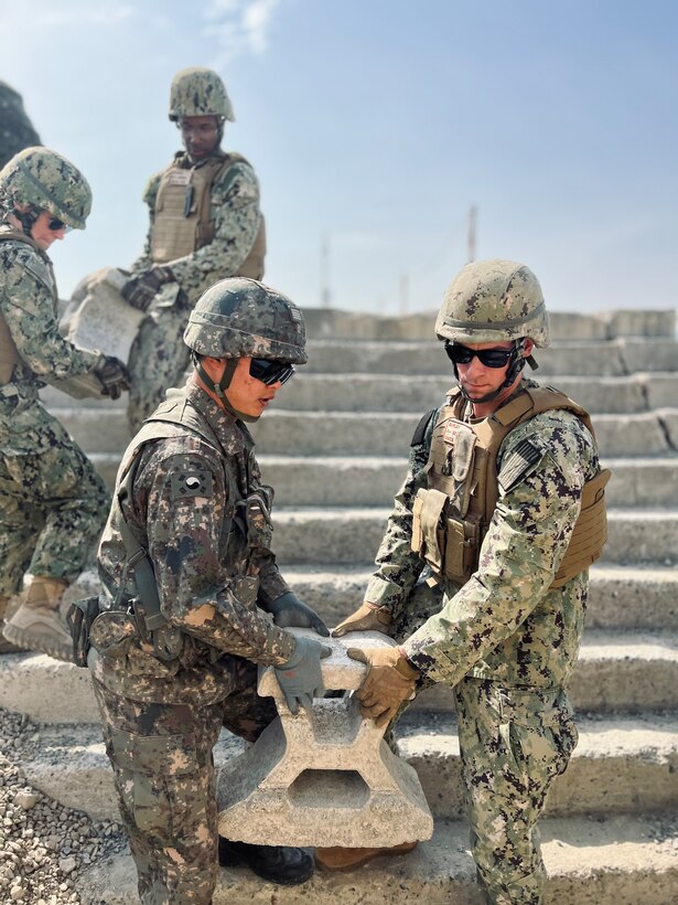 U.S. and Republic of Korea Seabees conduct a joint port damage repair exercise at Jinhae Naval Base.